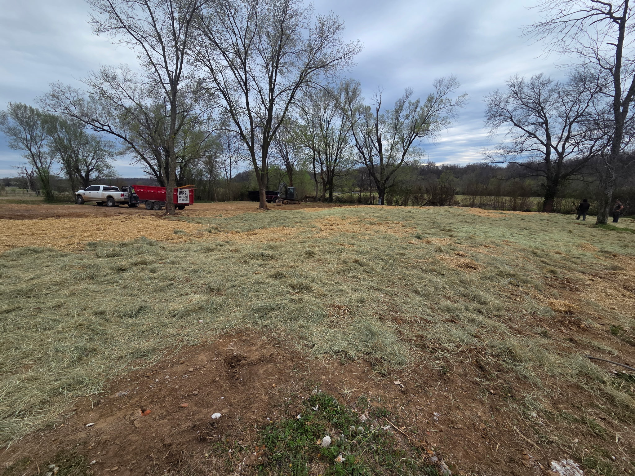 Later grass and straw-covered ground at Meyers’ Cave Springs residence demolition project