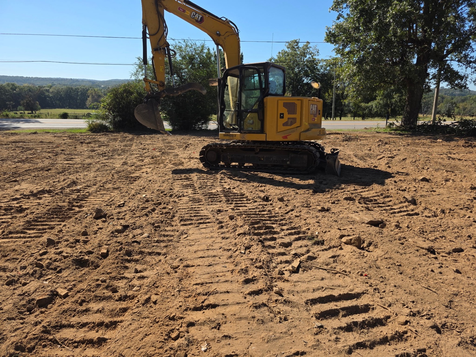 Meyers equipment at a rough grading work area in Conway
